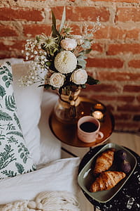 A lovely woman's bedroom with a beautiful bouquet of flowers thumbnail