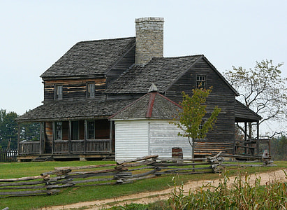 landscape photography of brown and white house thumbnail