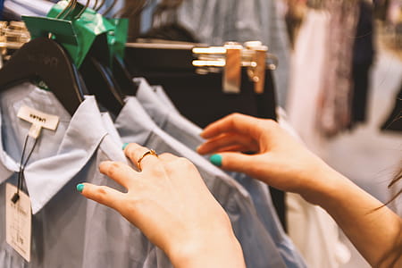 Woman chooses clothes in a store thumbnail