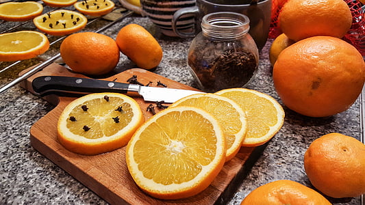 sliced orange fruits on chopping board thumbnail