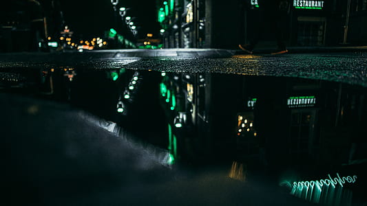 restaurant LED signage mirrored on water thumbnail