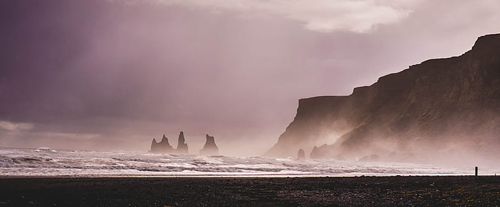 person taking photo of ocean waves thumbnail