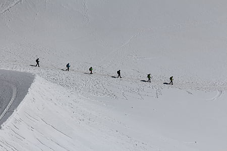 six person walking on snow thumbnail