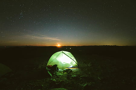 green camping tent during nighttime thumbnail