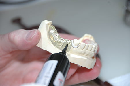 person holding silicone teeth mold thumbnail