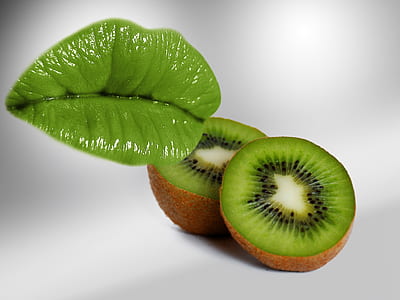 two kiwi fruits on top of white surface thumbnail