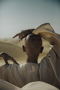 person with his hand on top of his head thumbnail