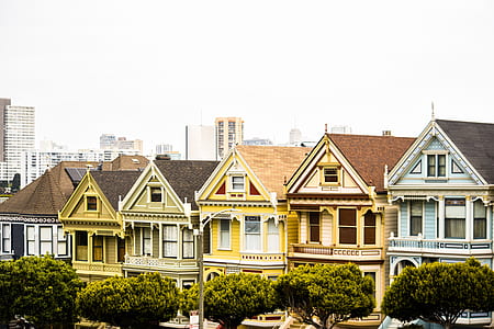assorted-color concrete houses under blue sky thumbnail