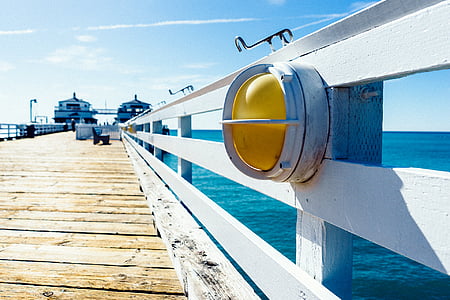 warning light placed on white wooden dockyard thumbnail