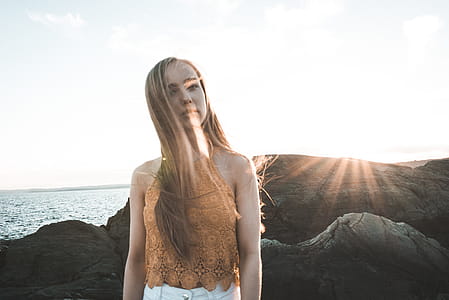 Woman Standing on Grey Rock Formation thumbnail