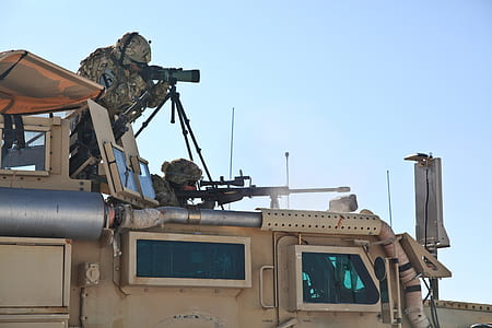 two snipers on top of vehicle under blue sky thumbnail