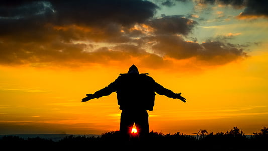 silhoutte of a person during sunset thumbnail
