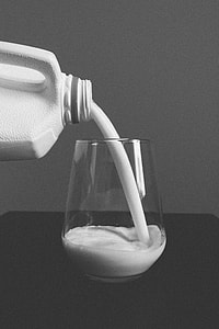 grayscale photography of bottle refilling drinking glass thumbnail