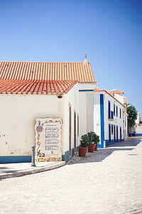 white 1-storey concrete houses beside road thumbnail