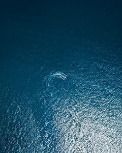 Aerial Photography of Boat on Body of Water thumbnail