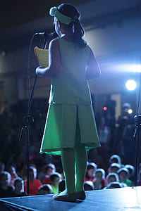 girl standing on stage thumbnail
