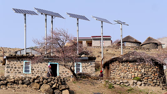 brown brick houses under solar panels thumbnail