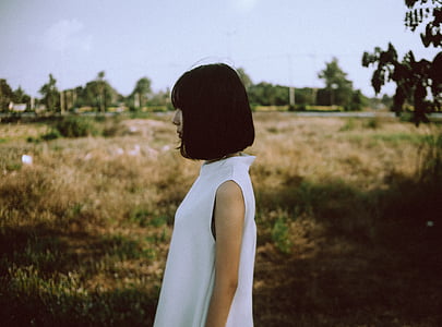 woman in white top facing right side thumbnail