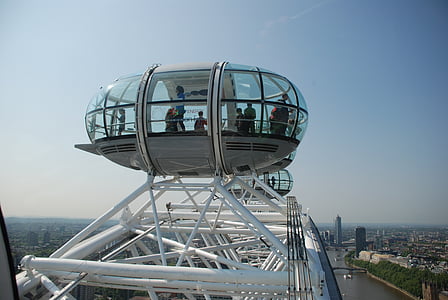 group of people standing inside glass container thumbnail