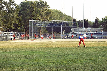 people playing baseball on field taken during daytime thumbnail