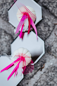 Decorative white pumpkin trinkets with ribbons on the floor thumbnail