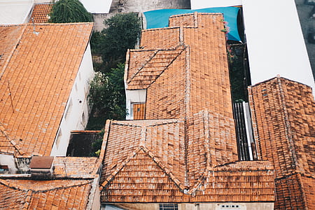 bird's eye view photograph of brown shingles roof of house thumbnail