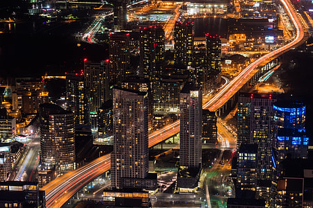 aerial and time lapse photograph of city at night thumbnail