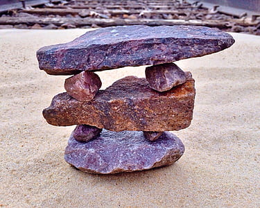stacking stones on sand thumbnail