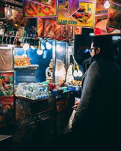person buying a food at street store thumbnail