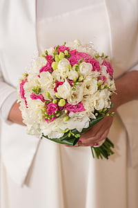 woman in white dress holding white and pink flower bouquet thumbnail