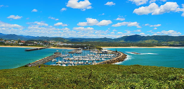 aerial view of boats on body of water during daytime thumbnail