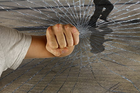 man punching glass thumbnail