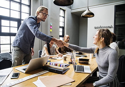 Man and Woman Shake Hands Inside Room thumbnail