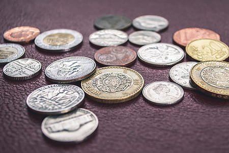 coin lot on maroon leather textile thumbnail