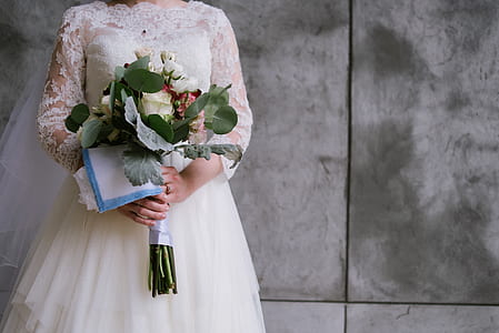 bride holding flower bouquet thumbnail