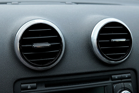 close-up photography of black vehicle AC thumbnail