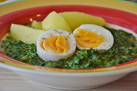 photo of soup dish with egg and papaya in red and yellow ceramic bowl thumbnail