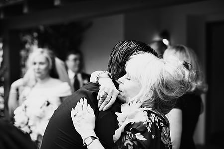man and woman hugging each other grayscale photography thumbnail
