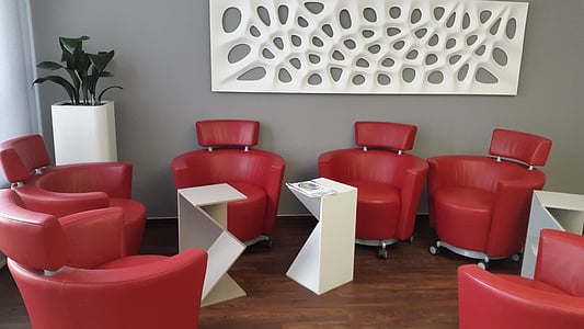 red leather chairs inside room thumbnail