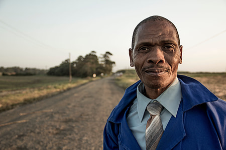 shallow focus photography of man in blue jacket thumbnail
