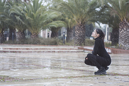 woman in black sweatshirt and leggings under rainy days thumbnail