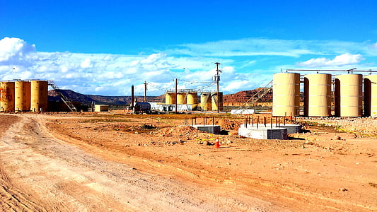 three brown silo during daytime thumbnail