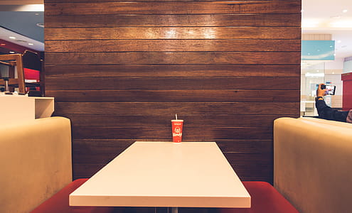 Red Disposable Cup on White Table thumbnail