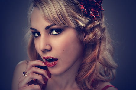 closeup photo of woman holding her cheeks thumbnail