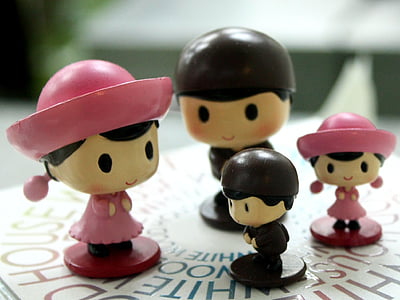 four brown-and-pink wooden toy on white surface thumbnail
