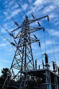 gray steel power lines under blue sky thumbnail
