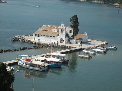 birds eye photography of boats beside dock and building thumbnail