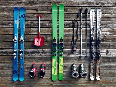 three pairs of snow skis with bindings and ski poles thumbnail