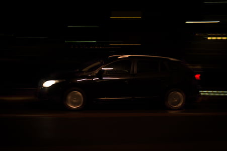 black SUV on road during night time thumbnail