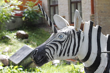 zebra statue in front of house thumbnail